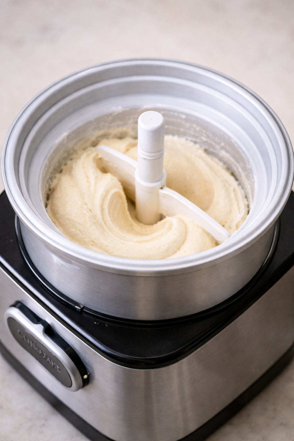 Vanilla ice cream churning in a home ice cream machine